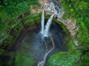 Aerial top view from above of Coban Sriti waterfall, Indonesia waterfall in Malang, East Java, Indon